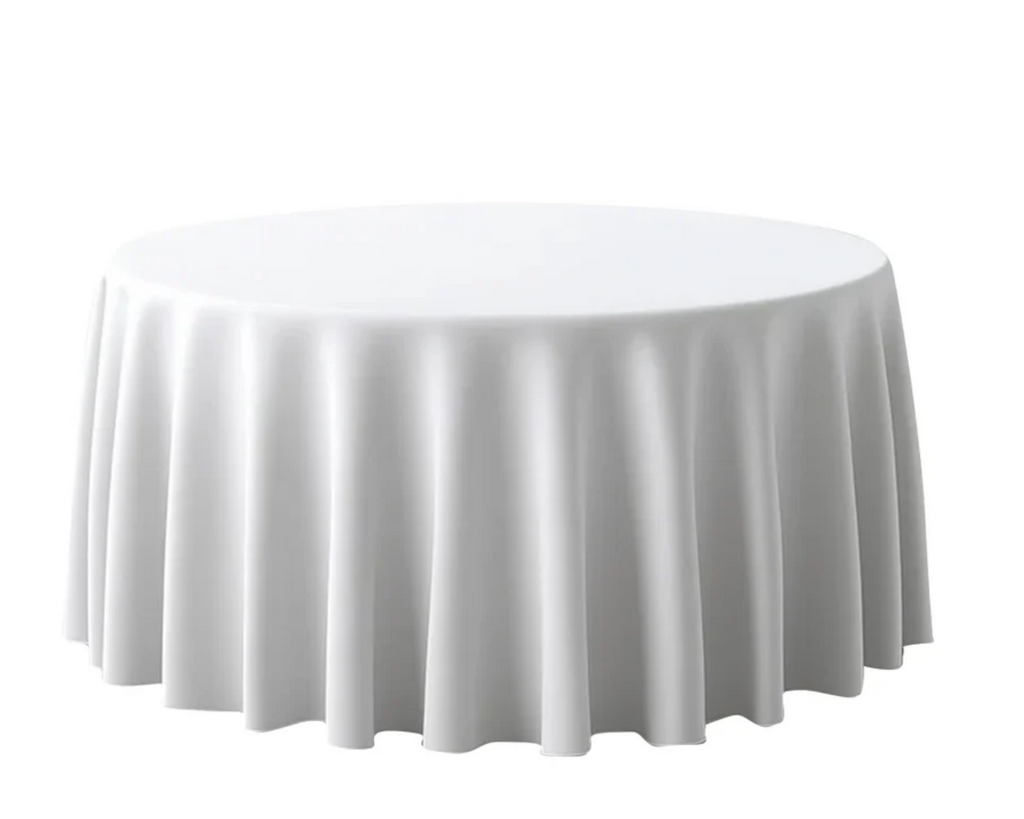 Round table covered with a white tablecloth on a white background