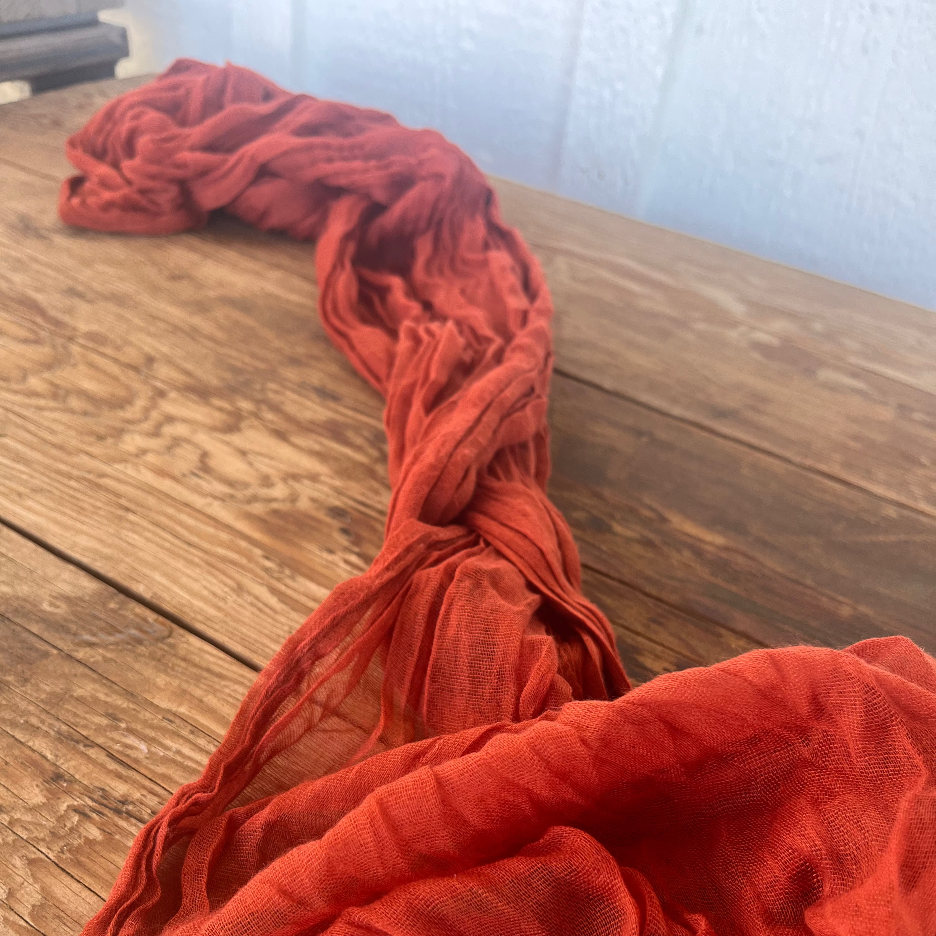 Orange fabric on a wooden surface