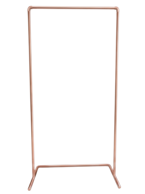 Rose gold clothing rack on a white background