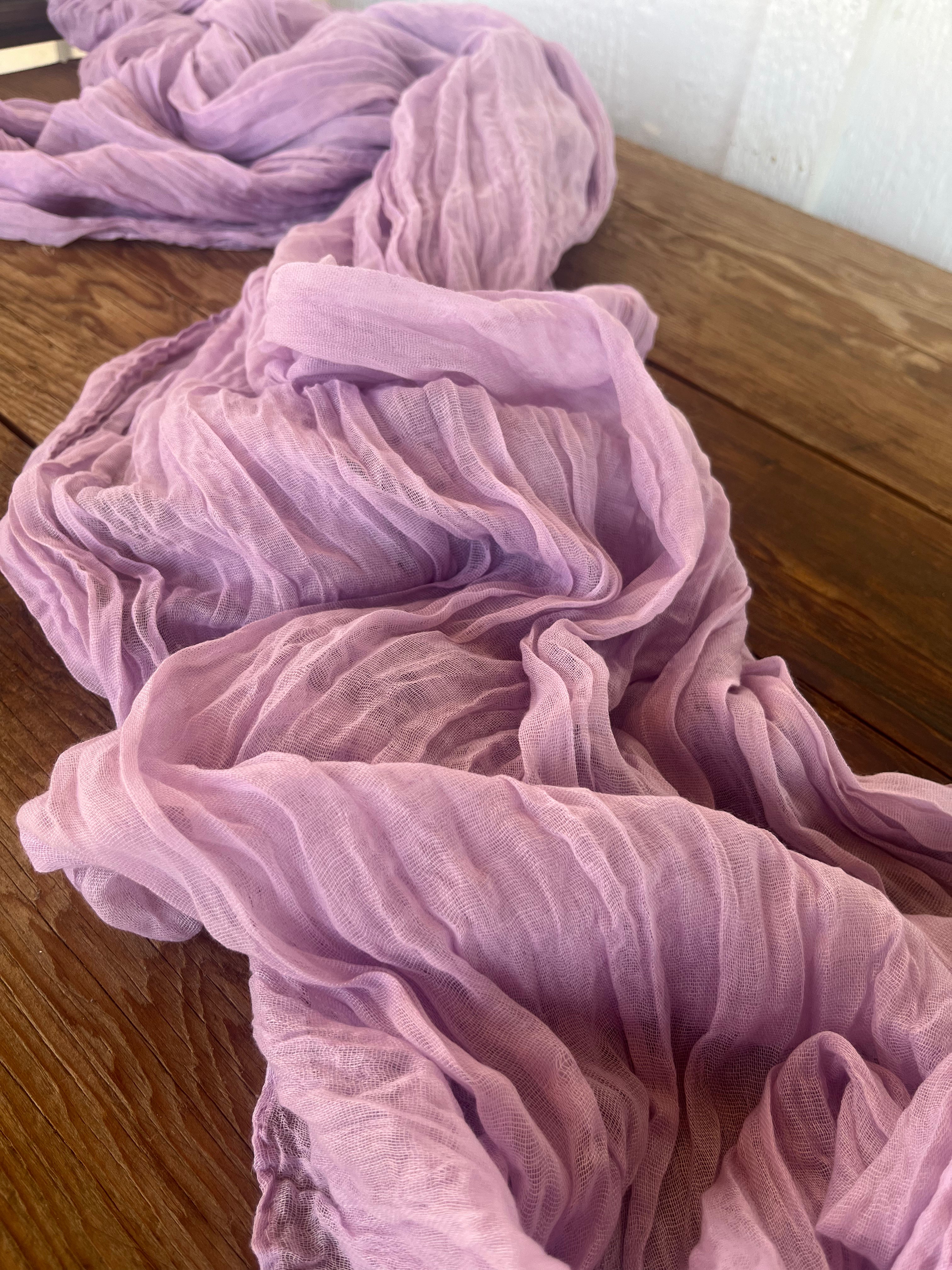 Purple fabric on a wooden surface